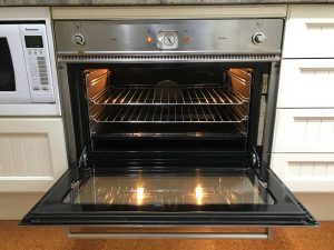 Image: a look inside a professionally cleaned oven by Oven Restore.